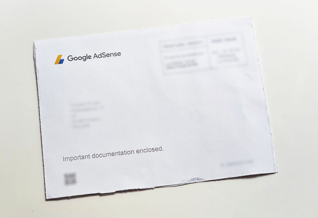 Google AdSense address verification letter with all the private information blurred out.