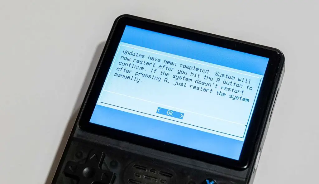 Successfully finished ArkOS system update on a handheld emulator console device.