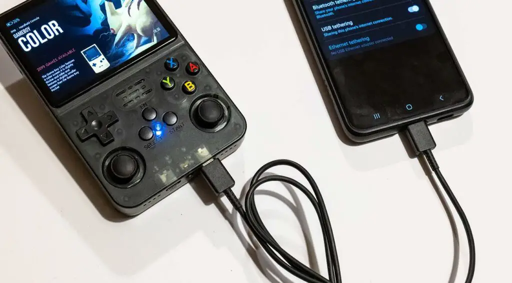 The R36S handheld console connected to an Android Smartphone using an USB OTG cable for network tethering.