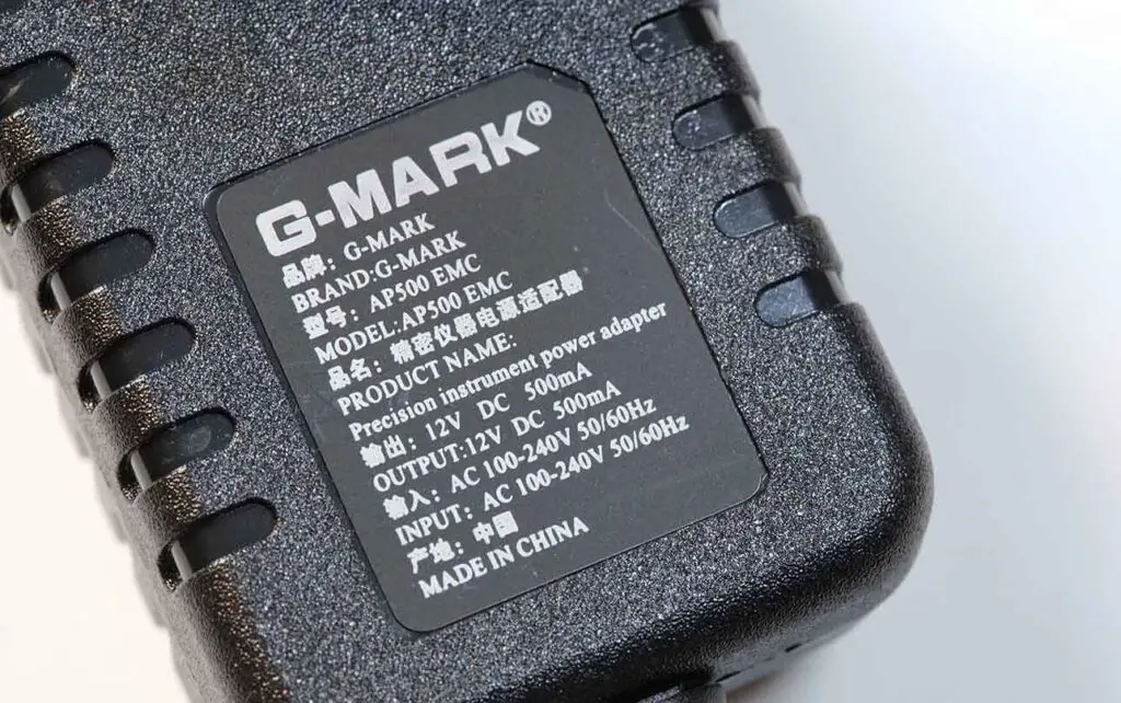 Closeup shot of the G-MARK AP500 power adapter parameters label.