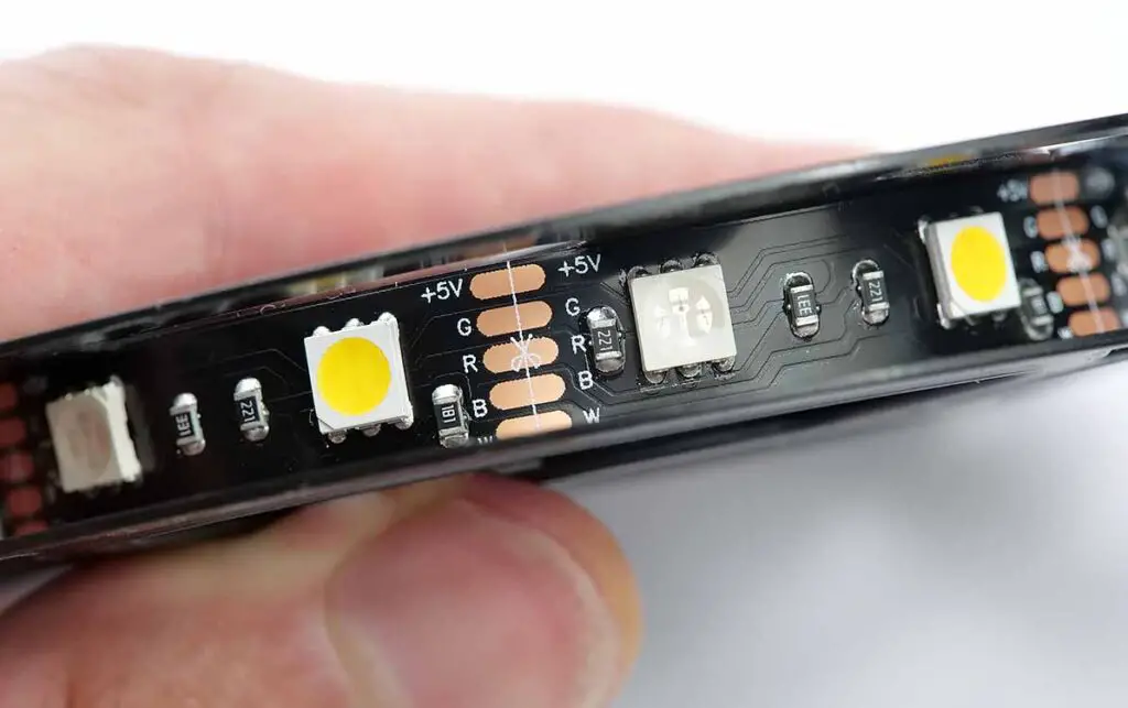 Close-up of an inexpensive RGBWW Zigbee light strip showing the individual LED spacing and the cut mark.