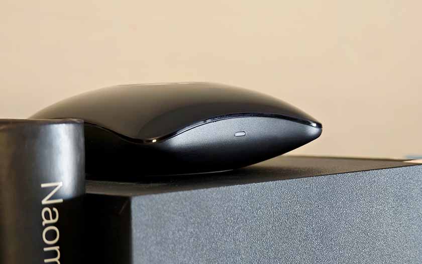 The Broadlink RM4 Pro on a shelf, closeup shot.