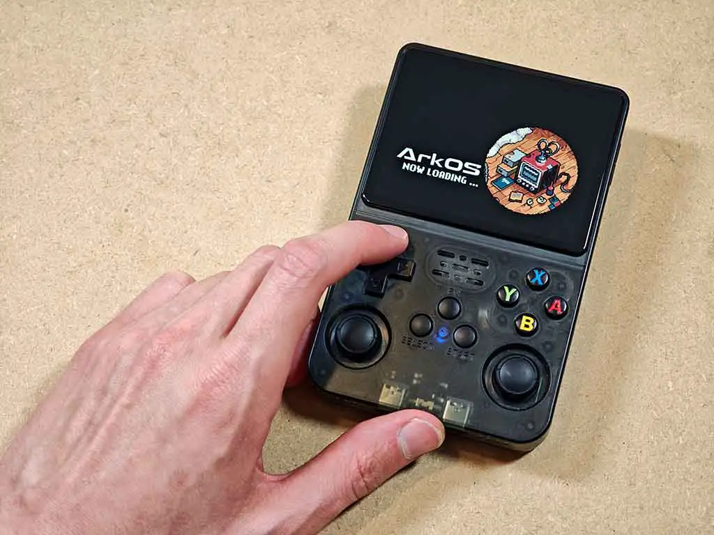 The R36S handheld booting into an older version of ArkOS-R3XS.