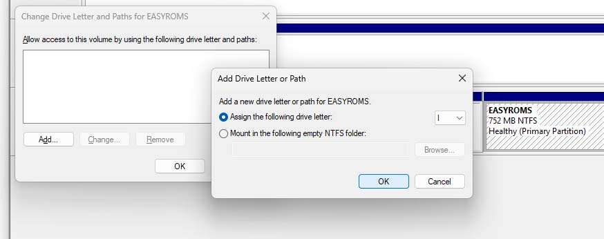 Windows Disk Management dialog showing a drive letter being assigned to the EASYROMS partition.