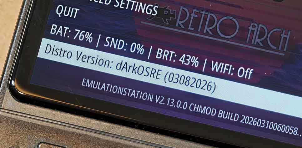 Close-up of the R36S system menu showing dArkOSRE version number and EmulationStation build details.