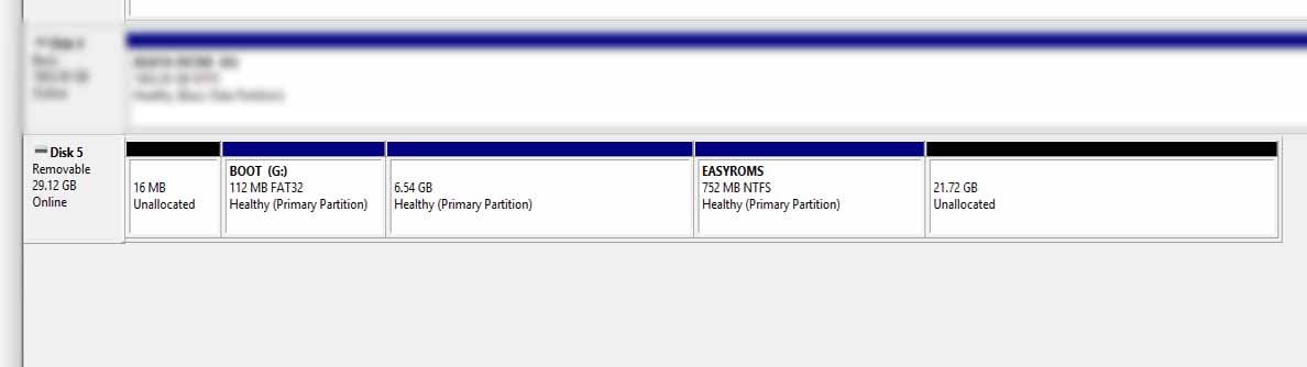 Windows Disk Management view showing an R36S microSD with a small EASYROMS partition and a large block of unallocated space.