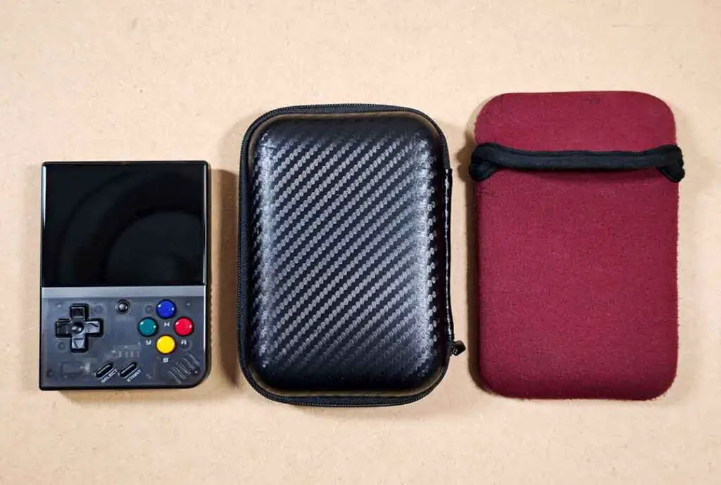 Miyoo Mini Plus next to a basic carrying case, and a repurposed portable drive sleeve.