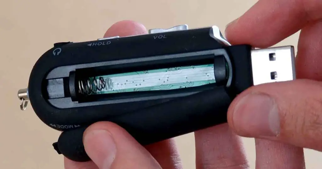 Open battery compartment of the MA933A-style MP3 player clone showing the single AAA battery slot.