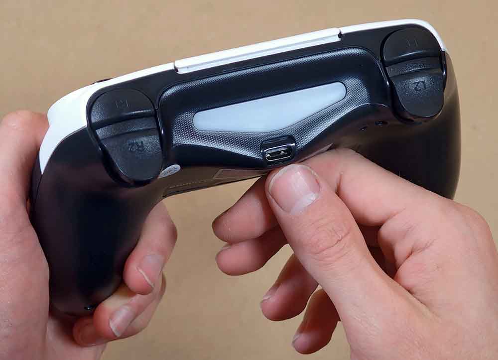 Back side of the controller showing the USB-C charging port and shoulder buttons.