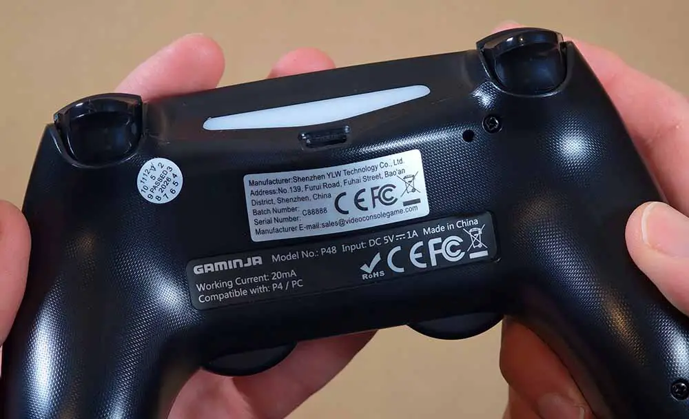 The manufacturer's sticker on the back of the controller.