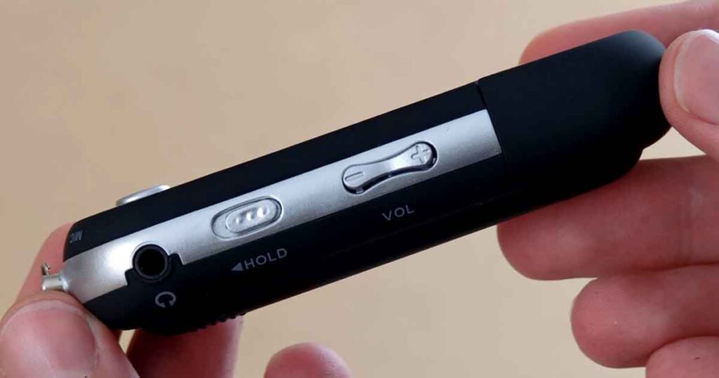Bottom side of the USB MP3 player clone showing headphone jack, hold switch, and volume control rocker.