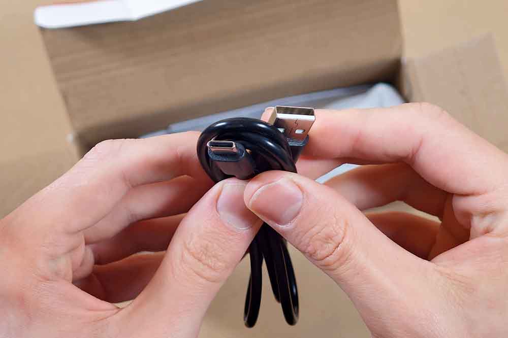 Short USB-A to USB-C charging cable included with the controller.
