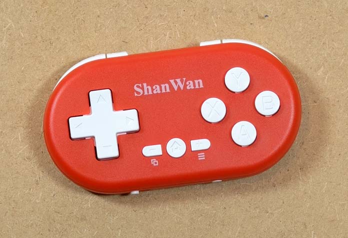 Top view of the red ShanWan Q36 mini controller.
