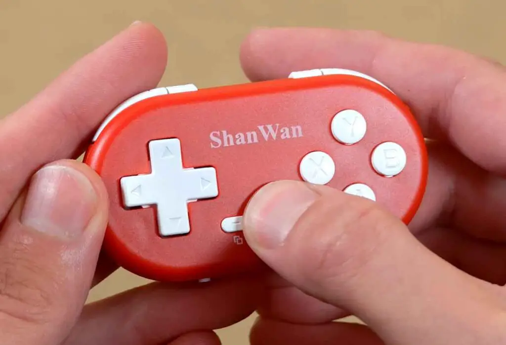 ShanWan Q36 in hands, closeup shot.