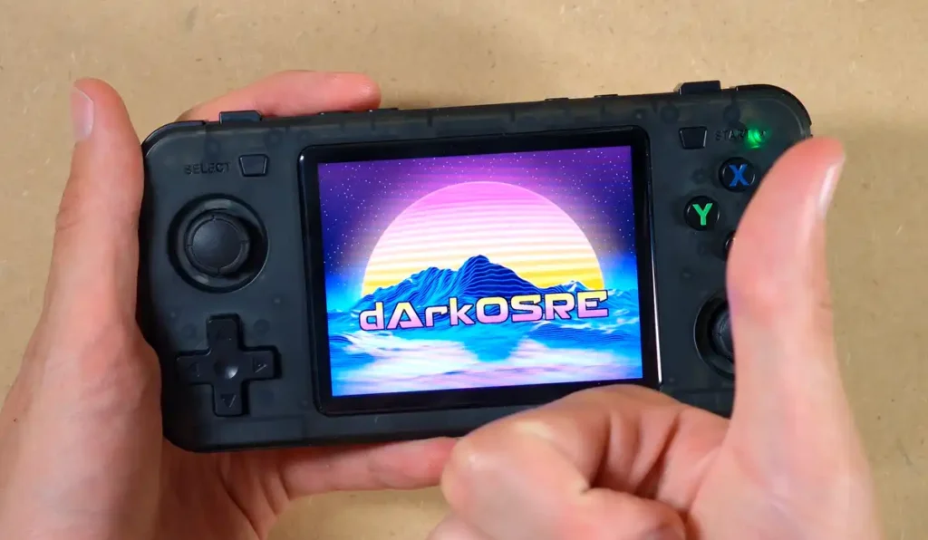 The reassembled R36H handheld turned on, showing the dArkOSRE boot screen.