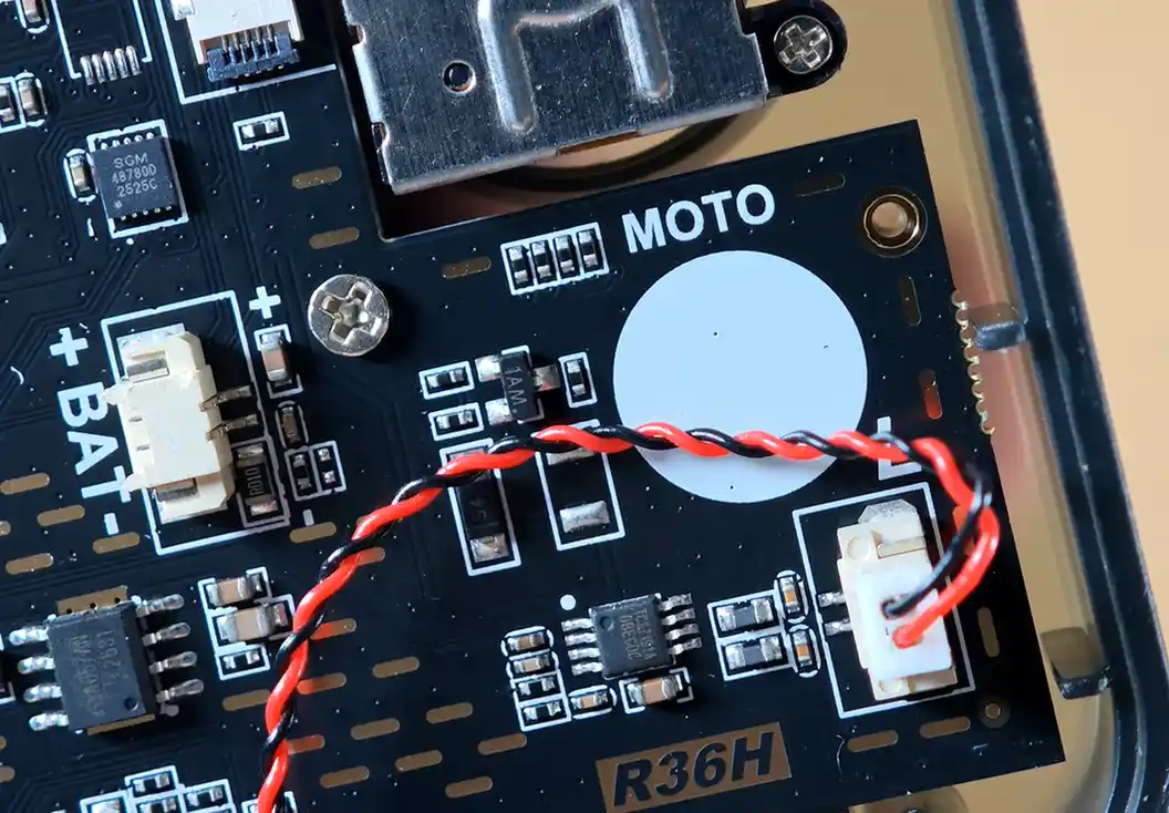 R36H mainboard area showing the BAT connector, speaker wire and empty vibration motor spot.