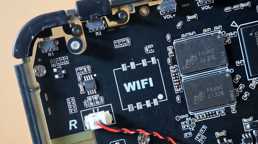 R36H mainboard close-up showing the empty Wi-Fi module footprint and two Micron RAM chips.