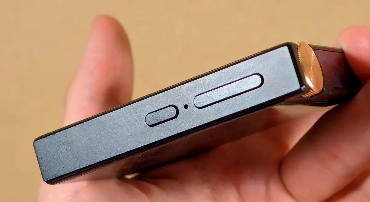 Power and track navigation buttons on the right side of the device.