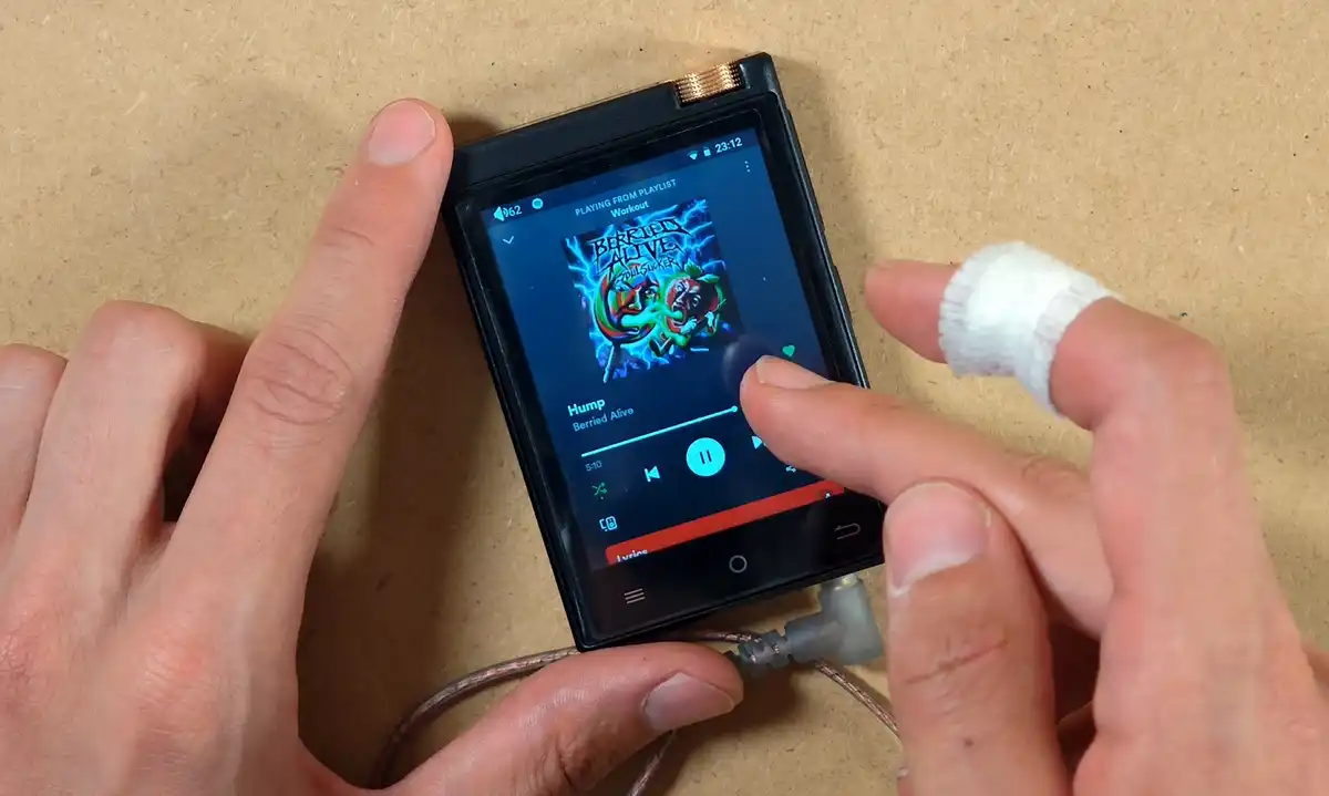 Spotify playback screen and track navigation on the M308.
