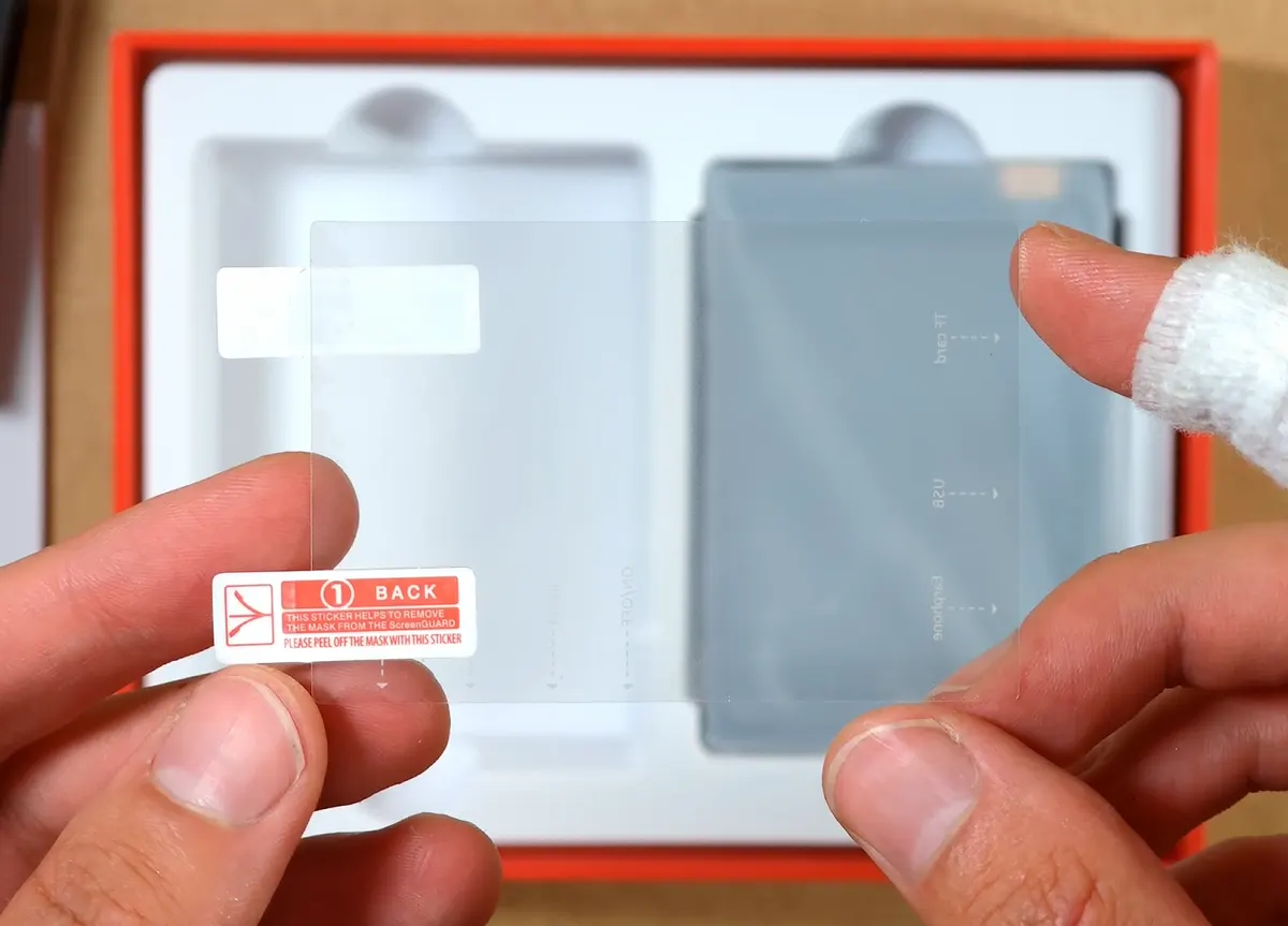Plastic screen protector included with the Oilsky M308.