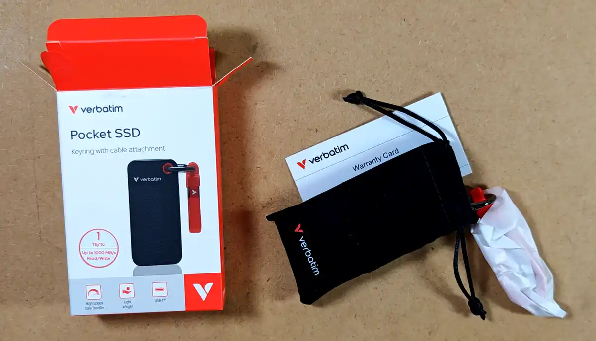 Verbatim 1TB Pocket SSD unboxed with its cloth pouch and warranty card.
