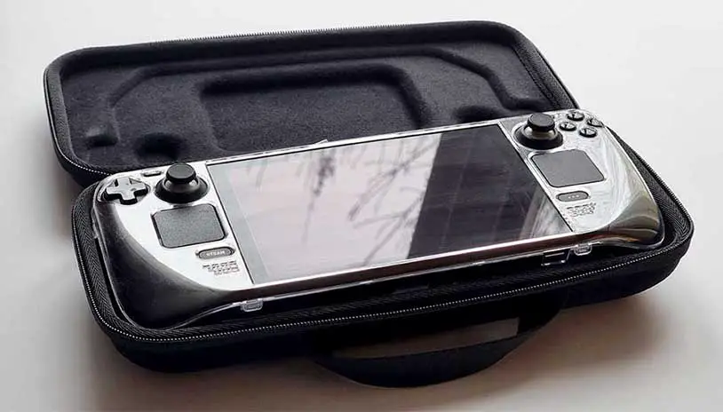 My first gen Steam Deck LCD with a custom transparent case sitting in the official open case.