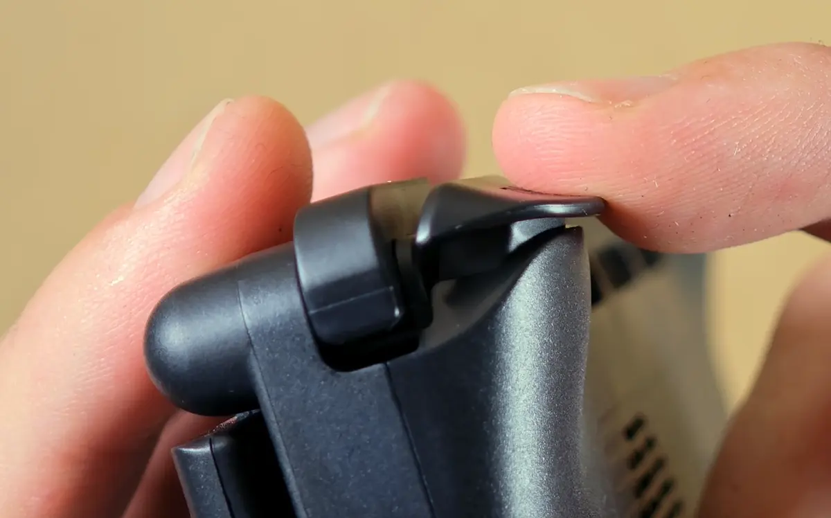 AYN Thor analog trigger held at maximum travel, a closeup shot.