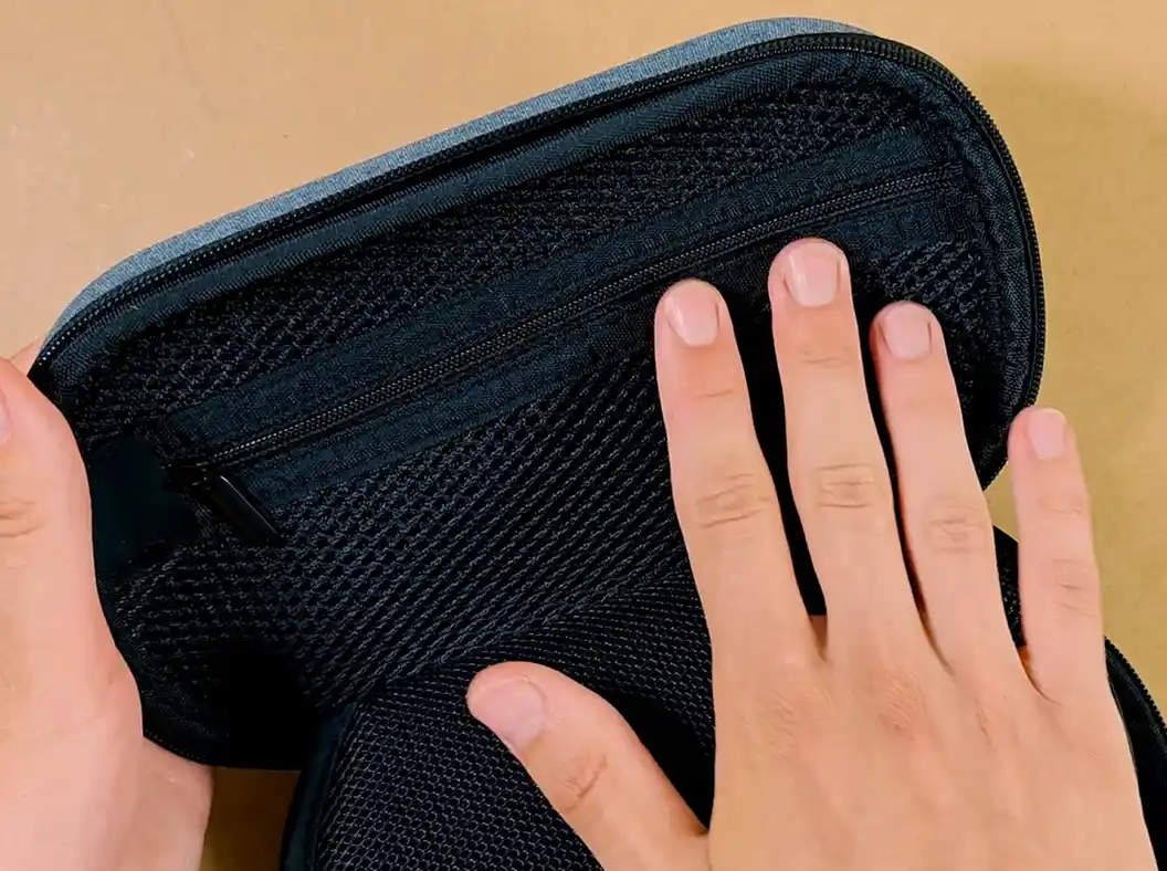 Mesh cable and accessory pockets inside the UGREEN organizer