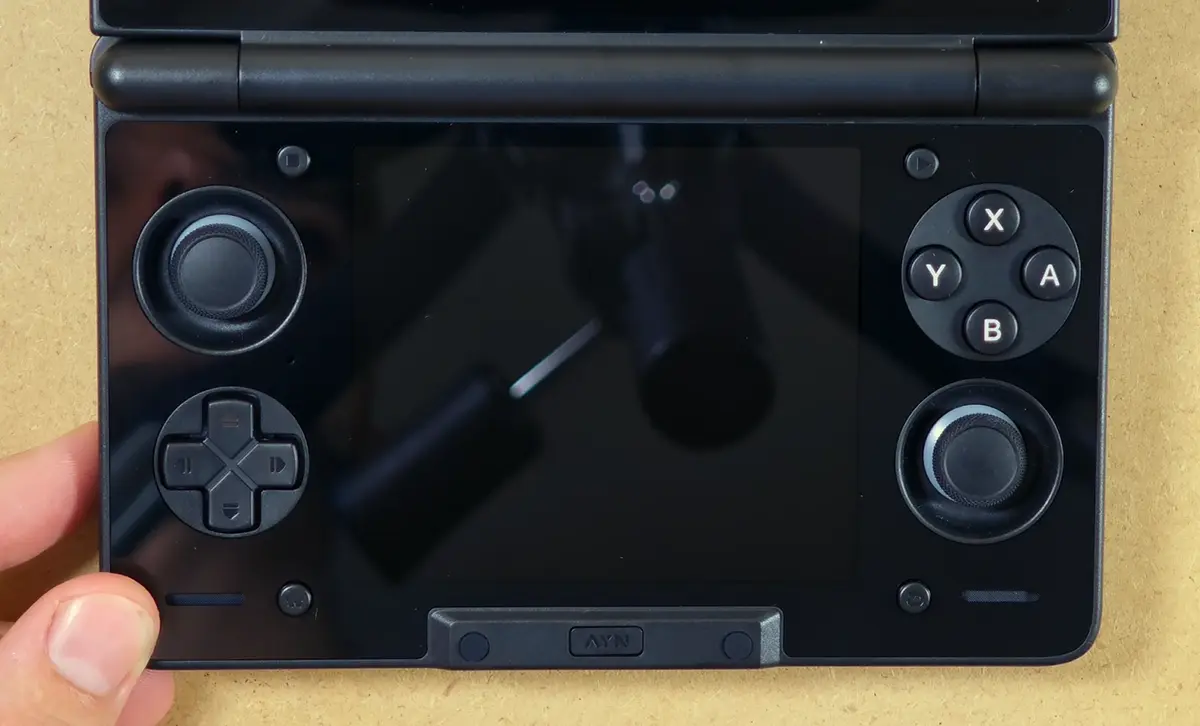 Glossy lower glass panel and controls on the AYN Thor